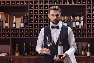sommelier with wine and glass