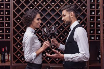 Sommeliers tasting wine in cellar