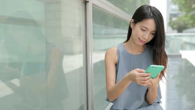 Business woman working on mobile phone