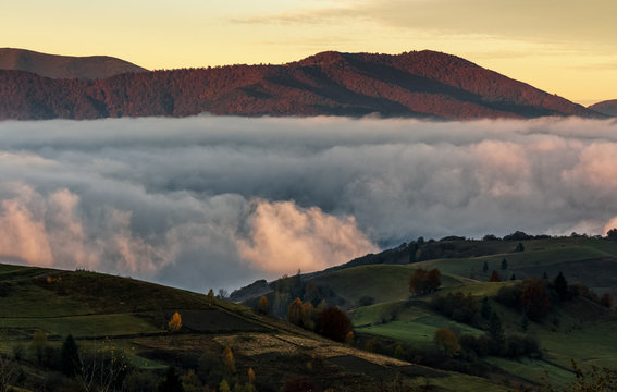 rising clouds in mountainous countryside before the dawn