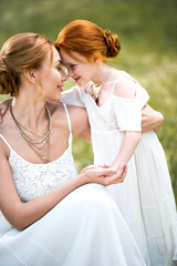 Fototapeta na wymiar mother and daughter in white dresses