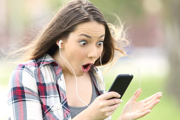 Amazed girl listening on line music