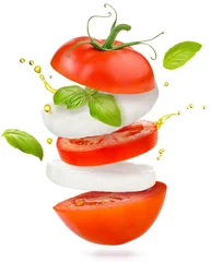 Foto op Plexiglas slices of tomato, mozzarella cheese and basil flying on white background © popout