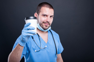 Doctor or medic showing coffee cup having a break