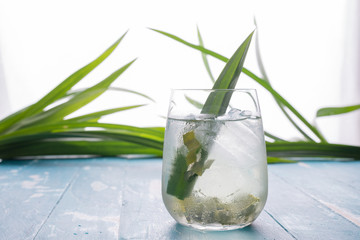 Fresh Fragrant Pandan  Ice Tea and leaves on wood background