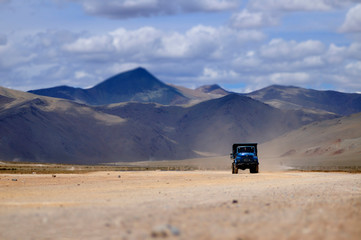 Truck through the desolate deserts and surrounded by high mountains. The distance from Manali to Leh Ladakh, India.