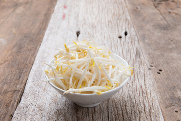 Bean sprouts on wood background