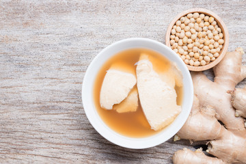 Bean junket eaten hot with gingered syrup, Soy custard