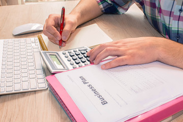 Businessman hand using calculator, accounting concept. Man hands