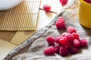 Ripe sweet raspberries on wooden table. Close up, top view, high resolution product