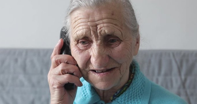 Old woman talking on phone.