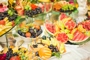 Authentic buffet, assorted fresh fruits, berries and citrus. Preparation for design creative menu