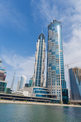 Fototapeta na wymiar Dubai - The skyscrapers over the new Canal and Burj Khalifa in the background.