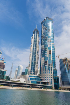 Dubai - The skyscrapers over the new Canal and Burj Khalifa in the background.