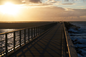 Obraz premium Sunset at the pier in nr. Vorupoer at the North Sea Coast in Denmark