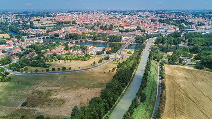 Aerial top view of Beziers town, river and bridges from above, South France
