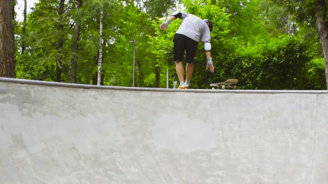 Young man skateboarding at outdoor skate park