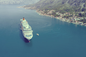 Fototapeta premium Tourist cruise liner in the bay. Toned