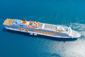 Luxury cruise liner in the blue sea, top view