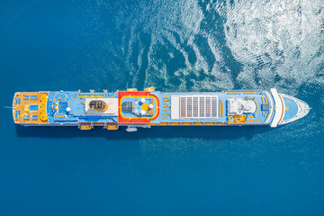 Beautiful cruise liner in the blue sea, top view