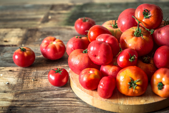 ripe Tomatoes on wooden background