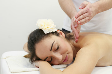 Obraz na płótnie Canvas Woman enjoying a massage treatment.