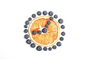 Seamless pattern with blueberry and dried grapefruit. Tropical abstract background whith rolled oats like a clock. Berries on the white background.