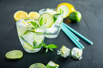 Refreshing citrus cocktail with crushed ice and lame with lemon