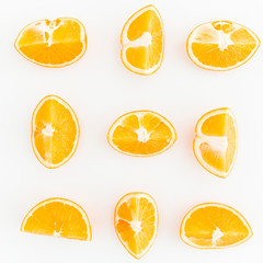 Food pattern of slices citrus fruits isolated on white background. Flat lay, top view.