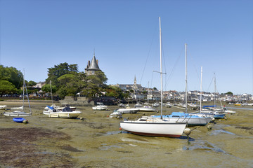 Fototapeta na wymiar Port of Pornic at low tide in Pays de la Loire region in western France