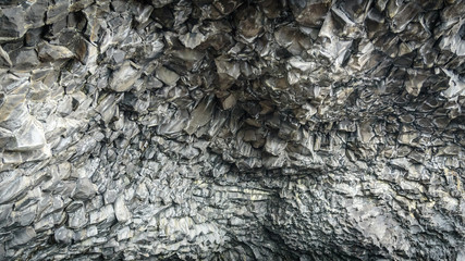 Natural basalt stone columns, Reynisfjara beach, Iceland, Texture and background