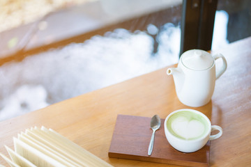 cup of coffee and book on the table