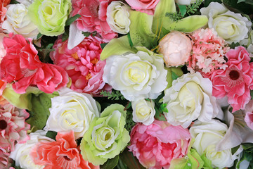 Artificial bouquet flowers background.