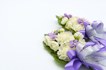 Jasmine handmade flowers made from handmade. Meaning is a representation of the love of the child, but the mother or the person they love. The belief of Thai people. White background. copy space