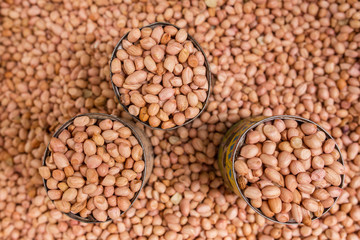 Roasted peanuts for sale on market. Food background