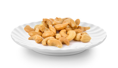 Cashews  in plate on white background