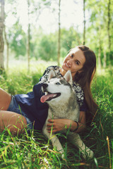 young woman with dog outdoor day portrait