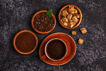 Obraz na płótnie Canvas Coffee cup, beans, ground powder and sugar.