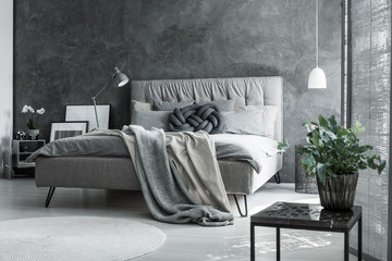 Gray bedroom with handmade pillow