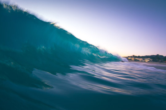 Slow shutter speed/water shot of a breaking wave at sunset.