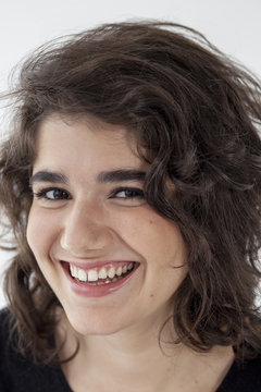 Close up portrait of smiling young woman.