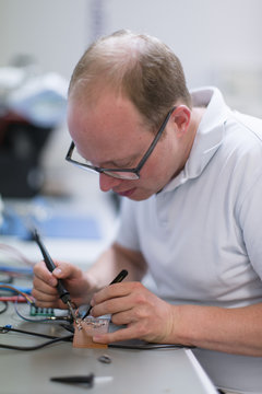 Young technican working in lab
