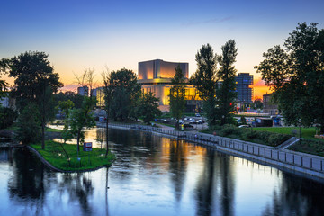 Architecture of Bydgoszcz city with reflection in Brda river at sunset, Poland