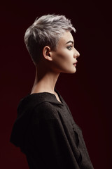 Beautiful young woman with short grey hair