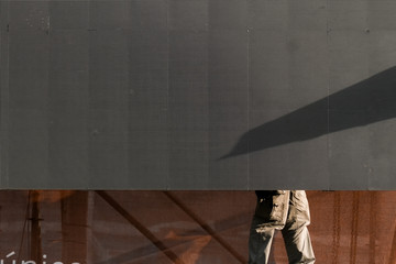 Legs of a worker while disarming a multi led display