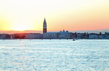 Naklejka premium SUNSET in VENICE in Italy and the Campanile of St. Mark