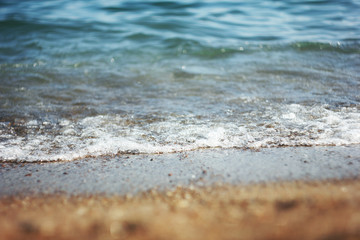Sea wave and wet sand. Summer and holiday concept