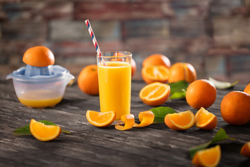 Glasses of fresh organic orange juice and fresh fruit.