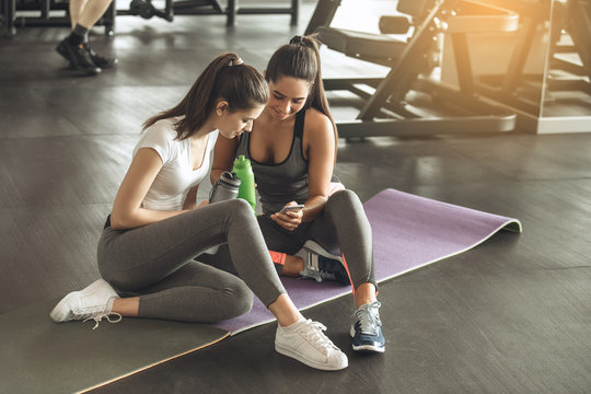 Young women exercise together in the gym