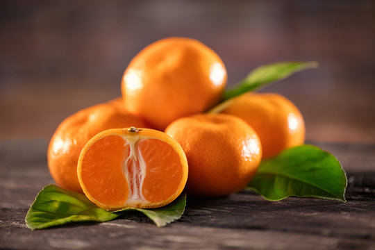 Healthy raw mandarin fruits background .